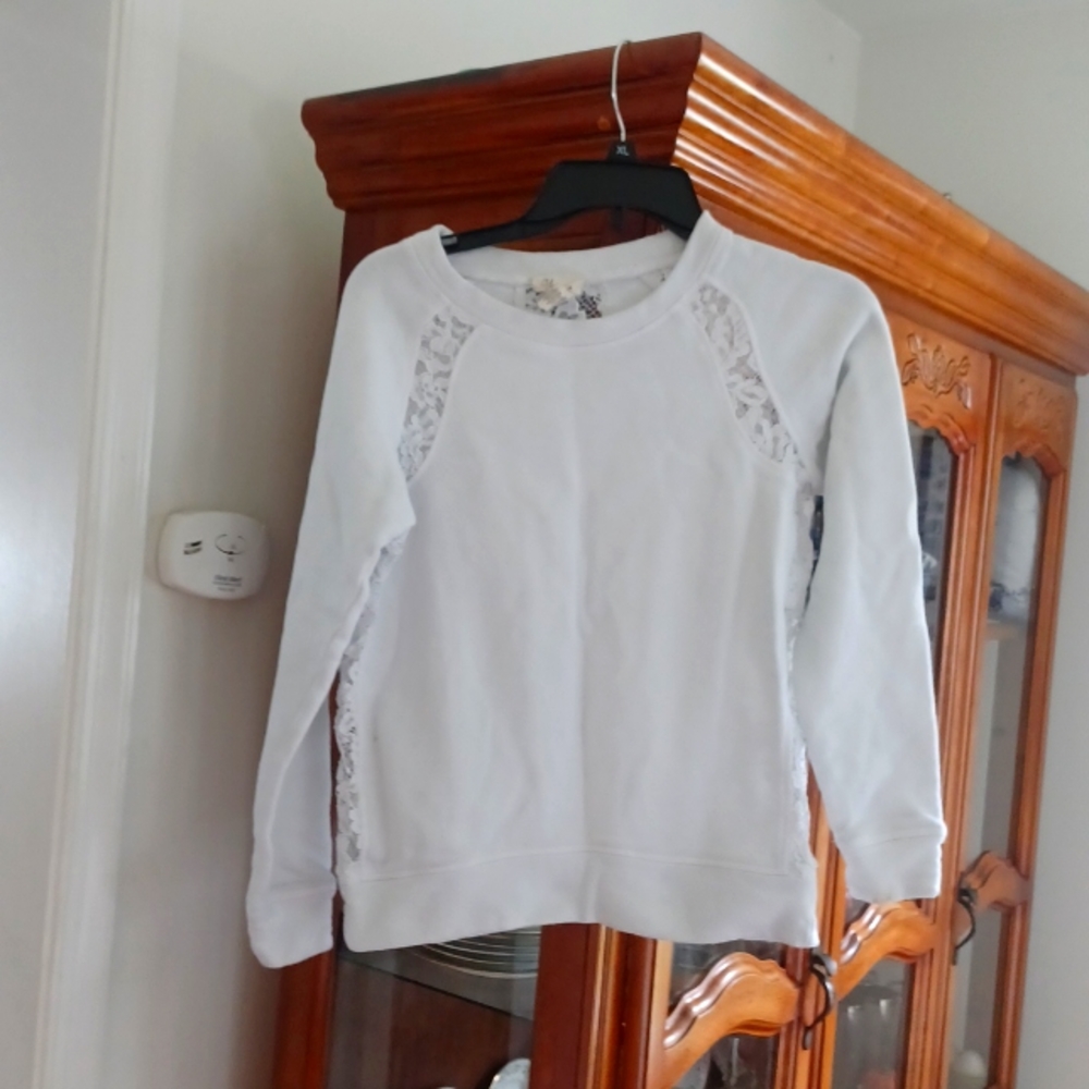 Andrea Jovine Lace inserts on a white sweat shirt